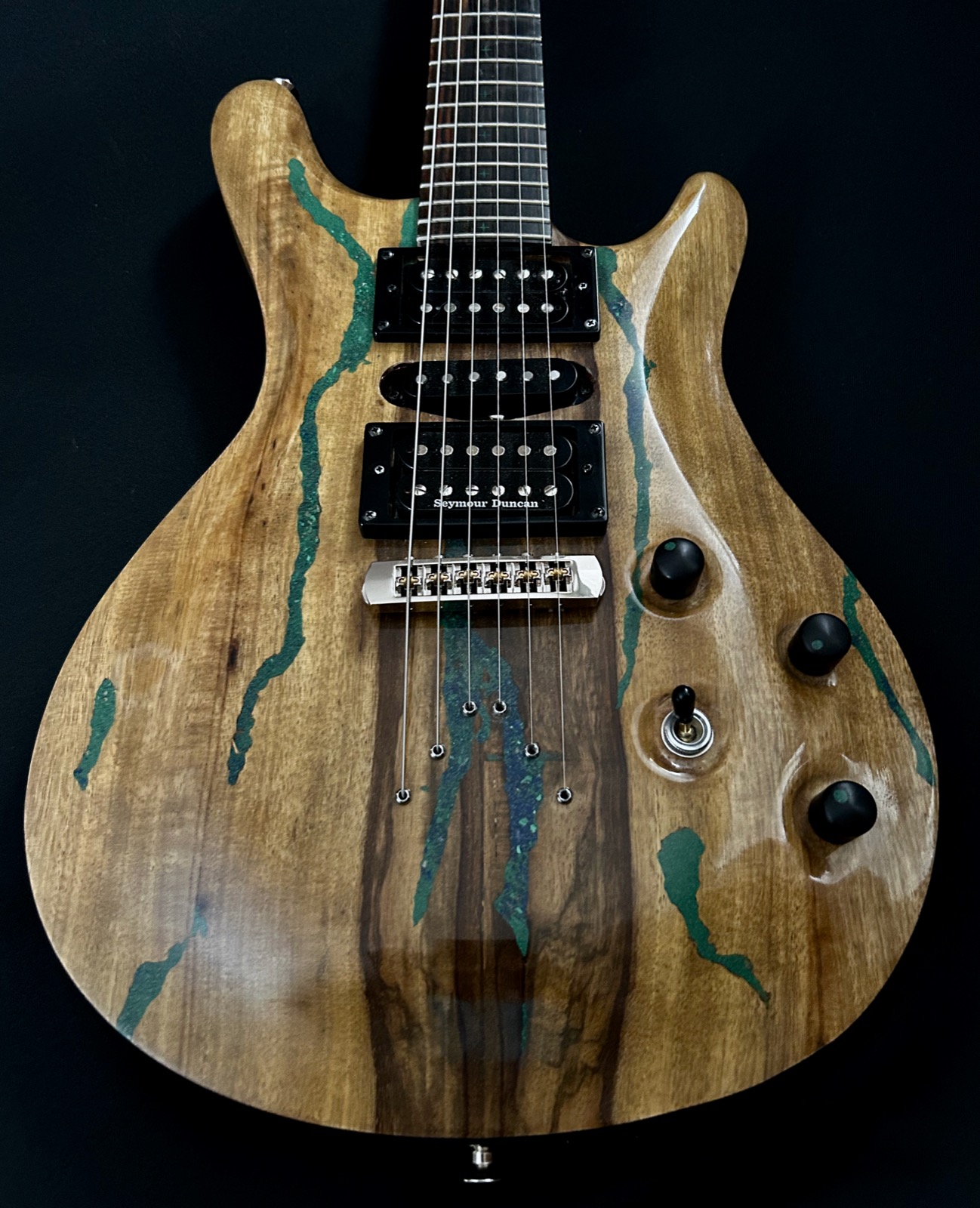 Black limba build outdoors with malachite inlay