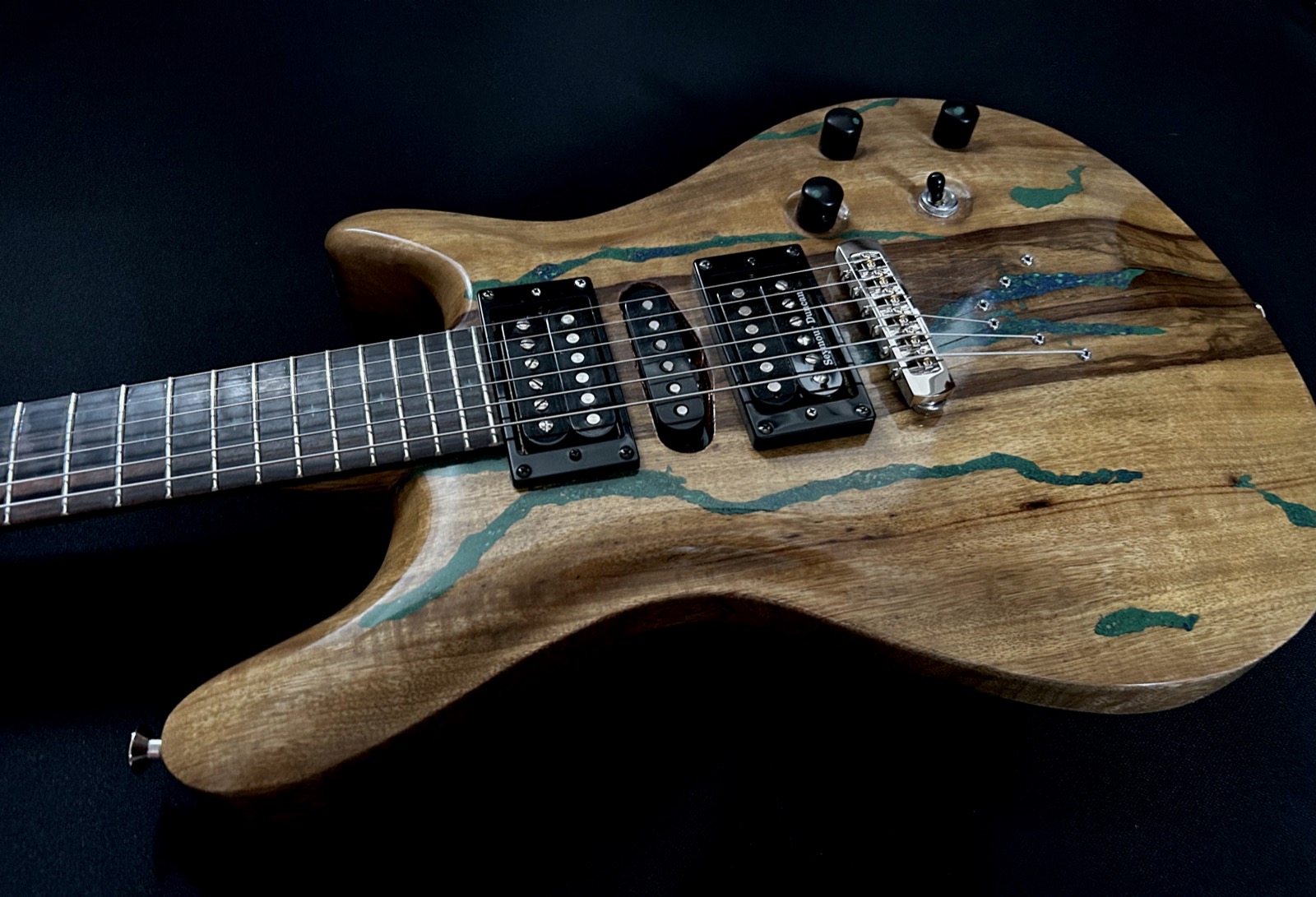 Black limba body with malachite star inlays